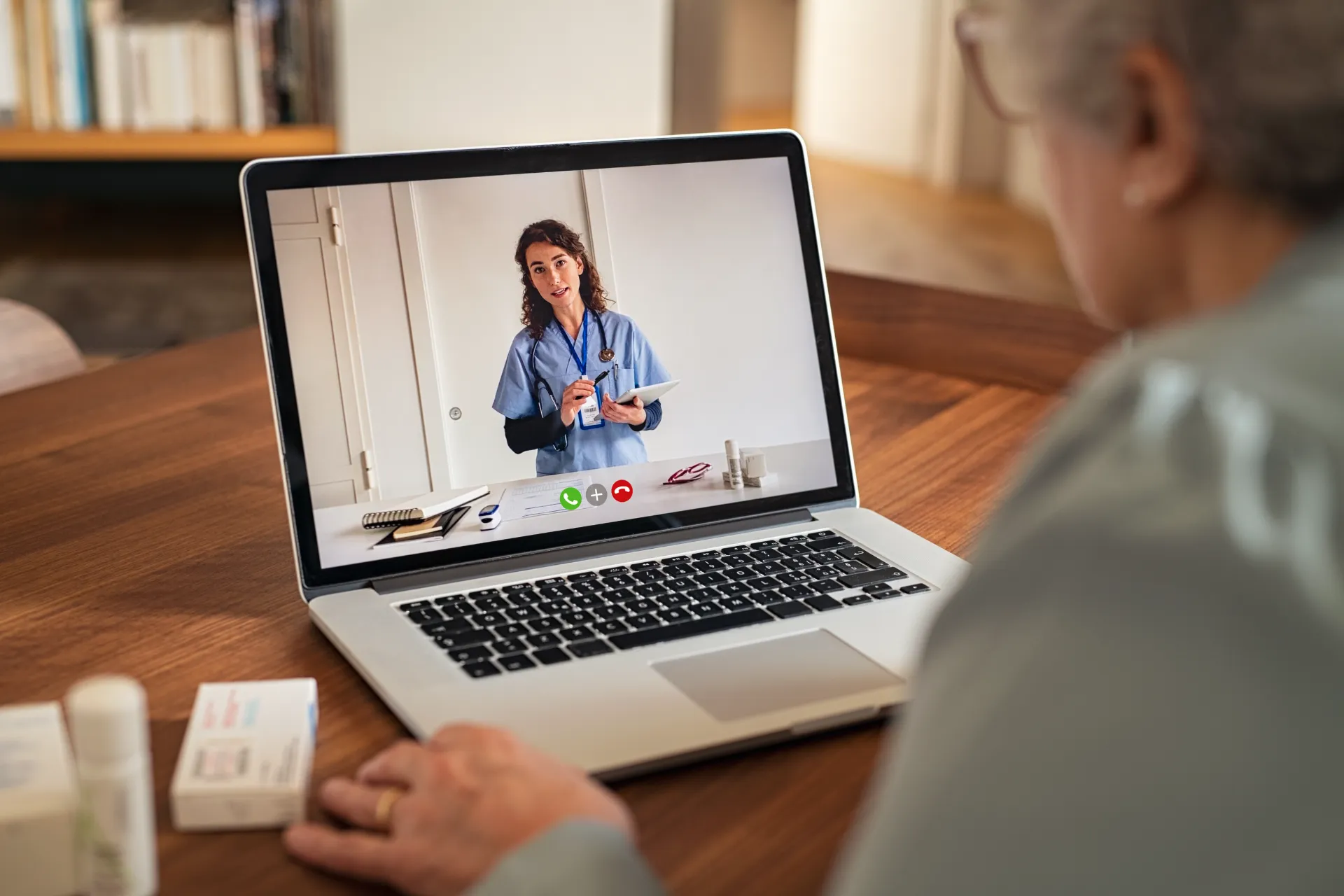 senior woman using telemedicine at home utc ()